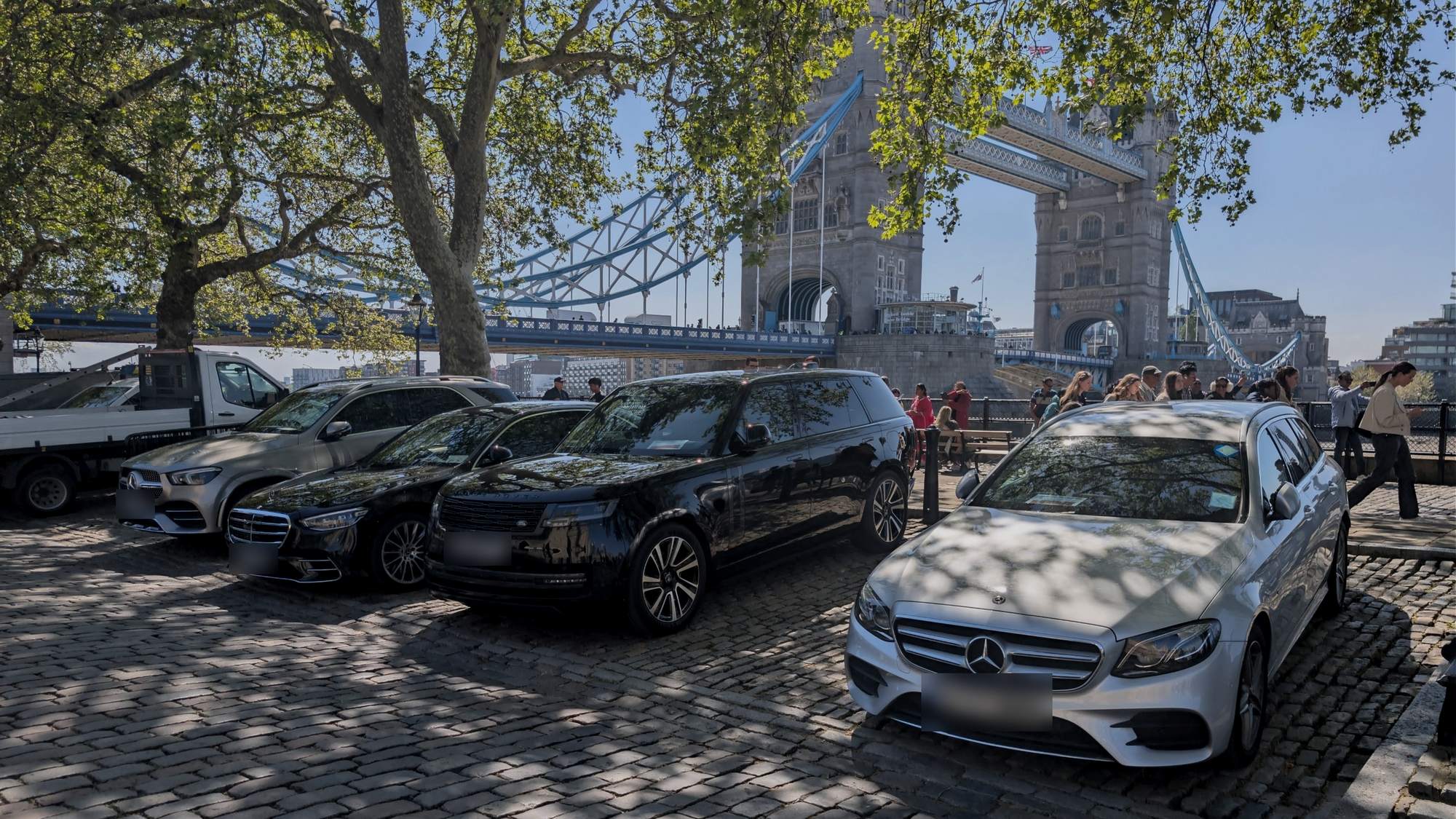 Executive chauffeur cars parked in front of Tower Bridge in London
